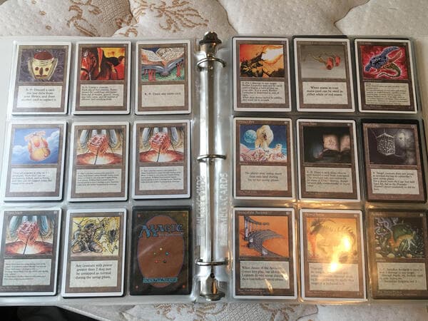 a binder filled with rare magic cards